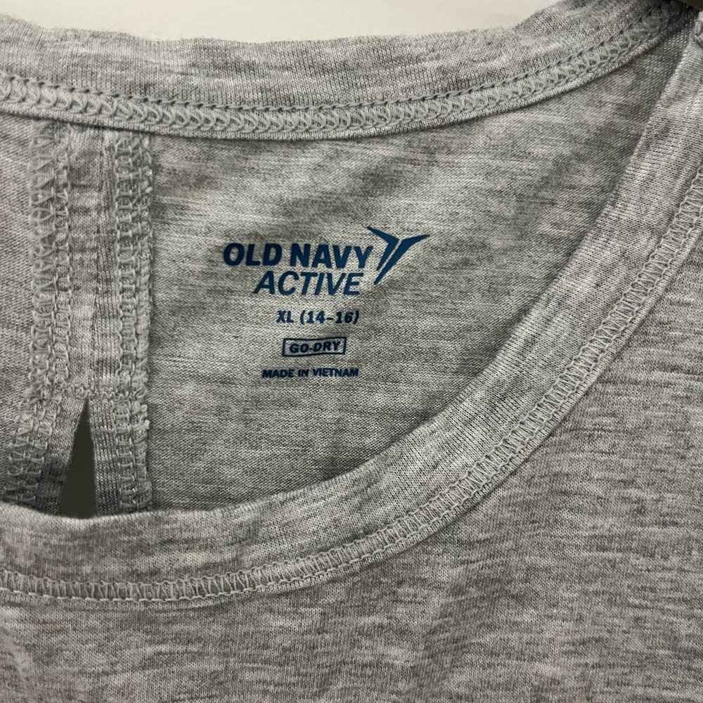 gray athletic shirt crossed back lightly worn